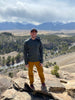Justin hiking in Buena Vista, Colorado with his On a Limb trucker hat