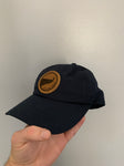 Dad hat with On A Limb Apparel logo - from angle